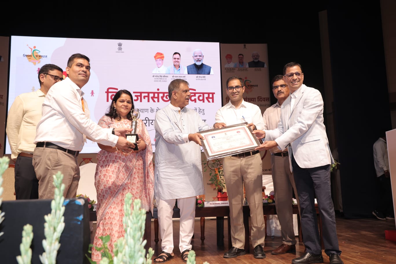 FRHS India receiving the Best NGO in Family Planning recognition at the Rajasthan state-level World Population Day event
