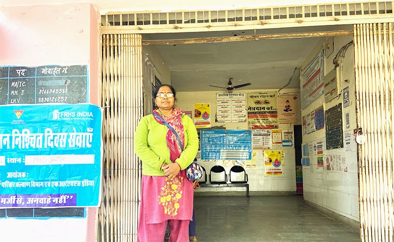 Lurd Mary standing at the entrance of Primary Health Centre Kuchil