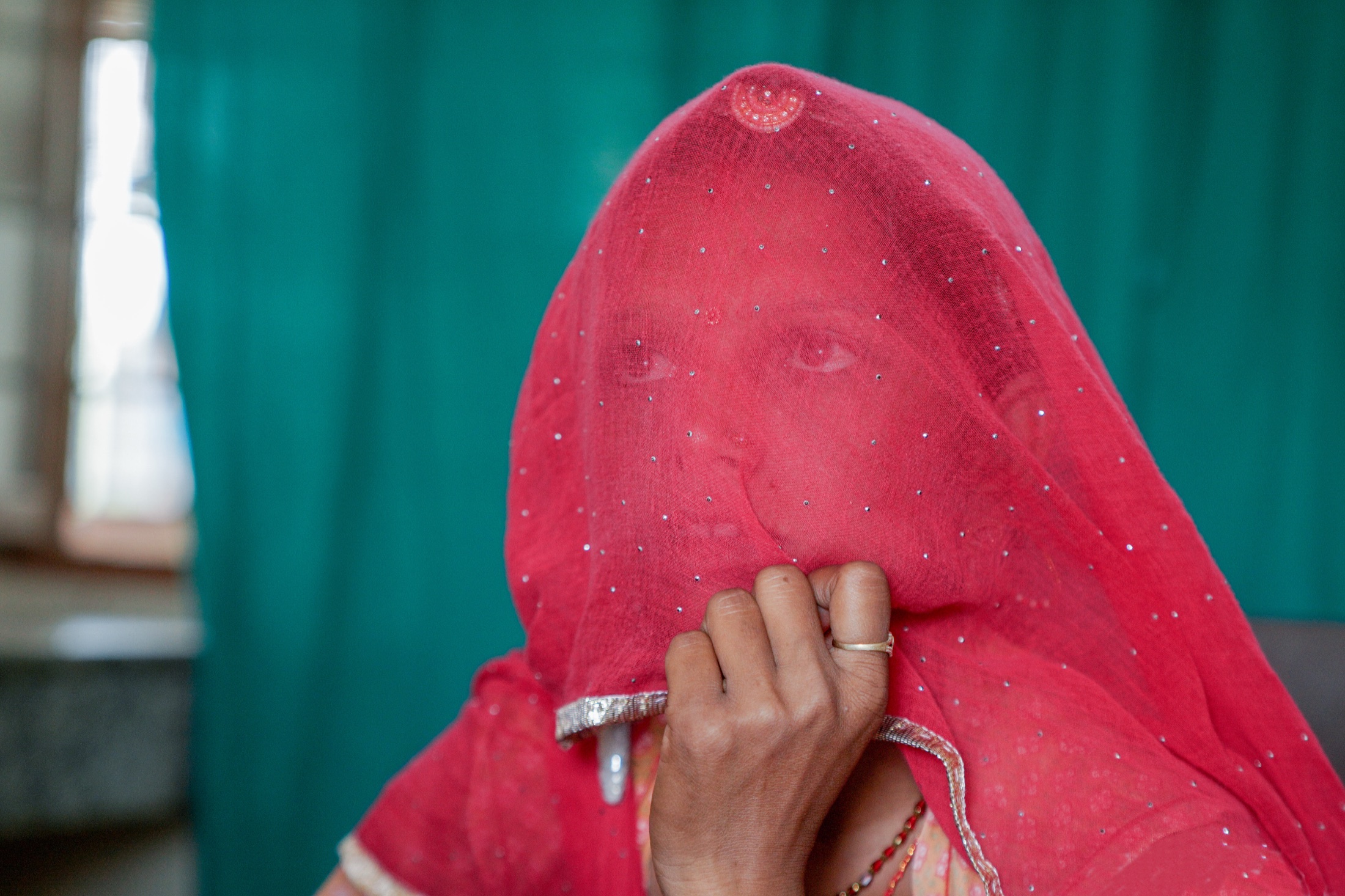 An FRHS India worker recording a client's details before counselling