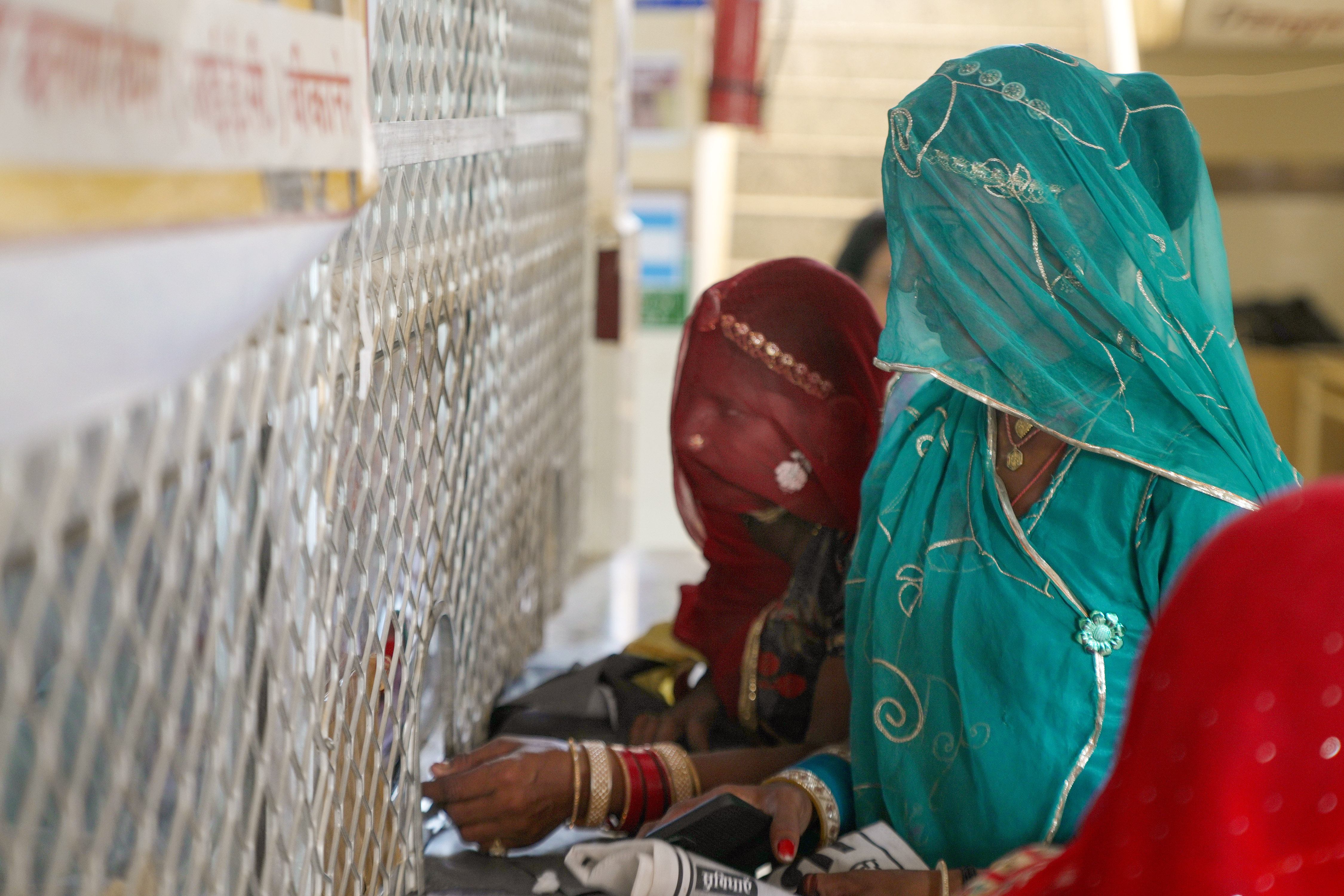 Clients waiting to register at a government primary health centre supported by FRHS India